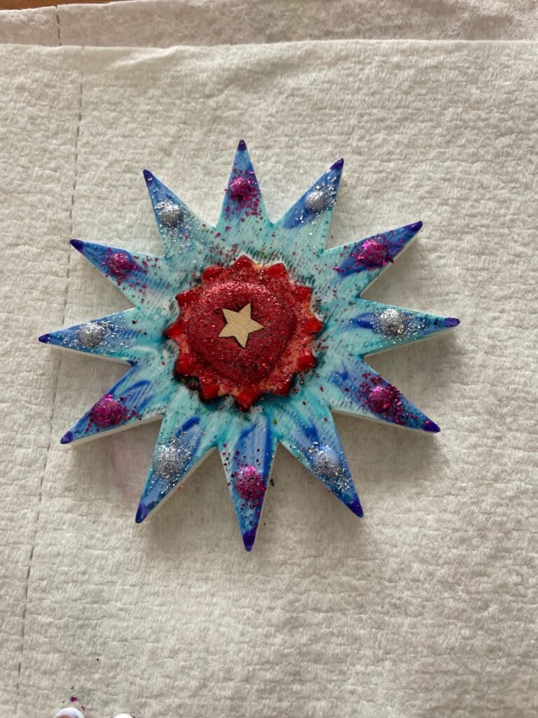 Kids craft snowflake, colored and painted.