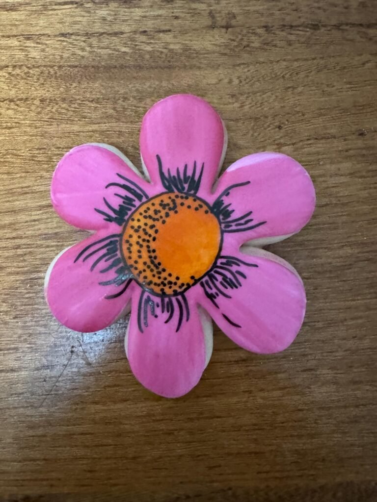 Decorated flower cookie made with flower, 6 petal cookie cutter sold on Donlon Duo.