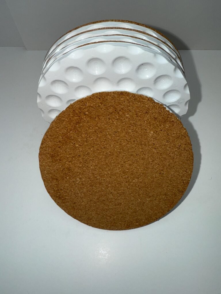 Golf ball coasters with cork backing.