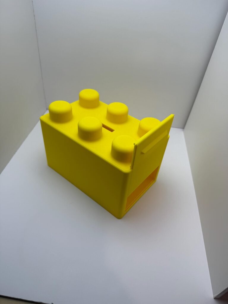 Yellow building block banks with trap door.