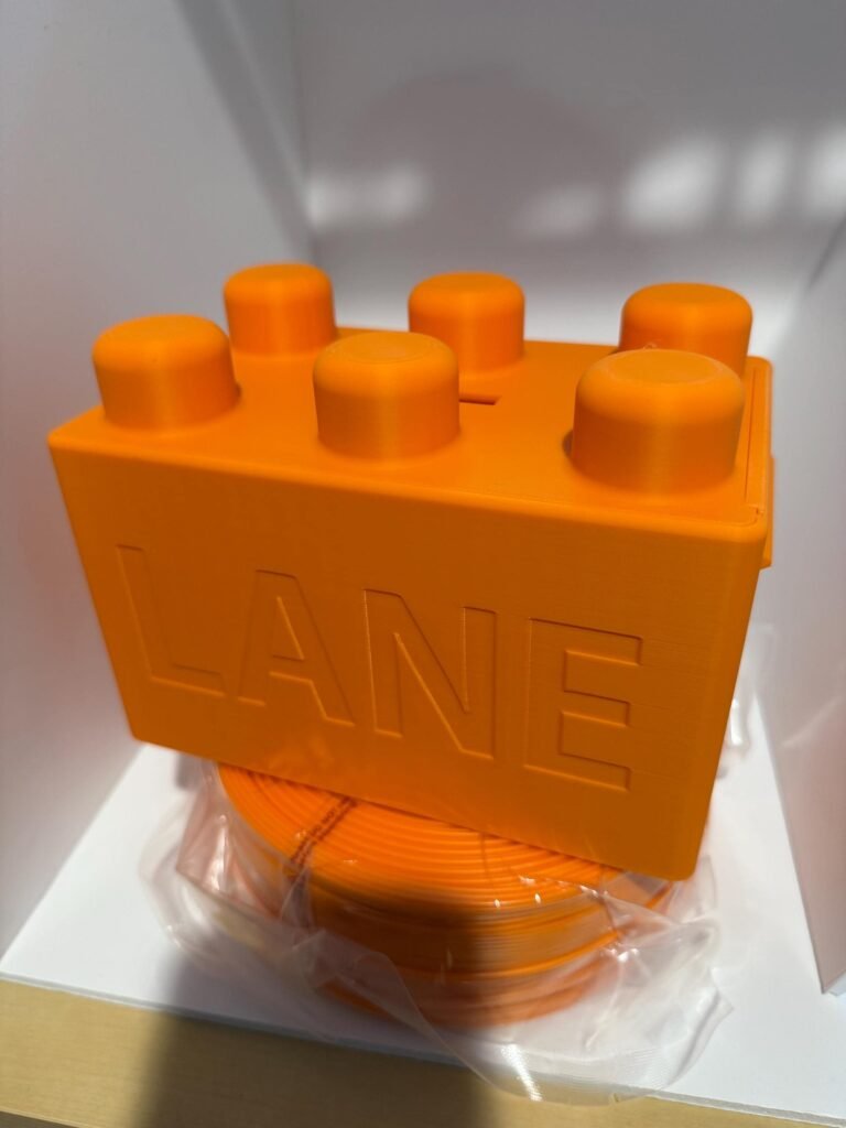 Personalized orange building block piggy bank.