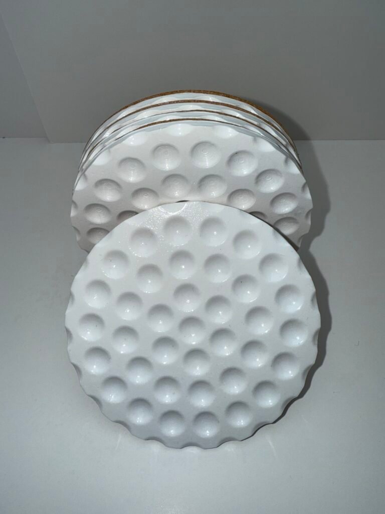 white, golf ball inspired drink coaster set.