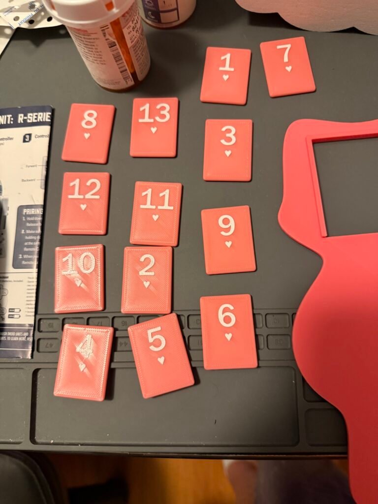 Pink Rummikub pieces.