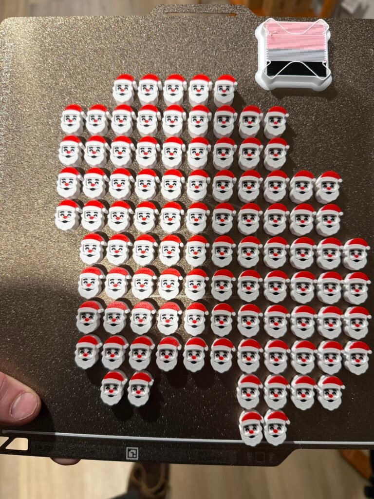 Santa clause face beads on a textured PEI plate.